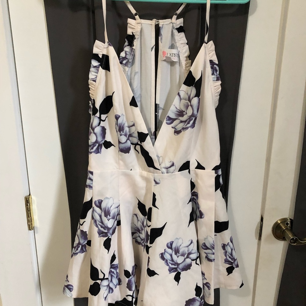 White and floral romper. Size medium.